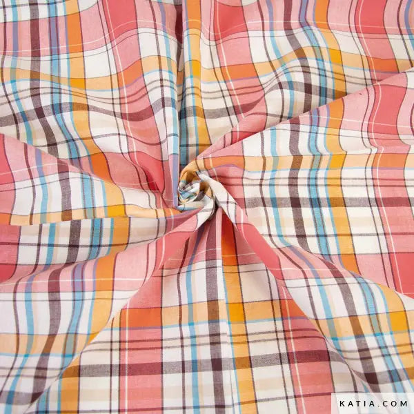 Africa Madras cotton gingham fabric in pink, orange, blue plaid, twisted at center.