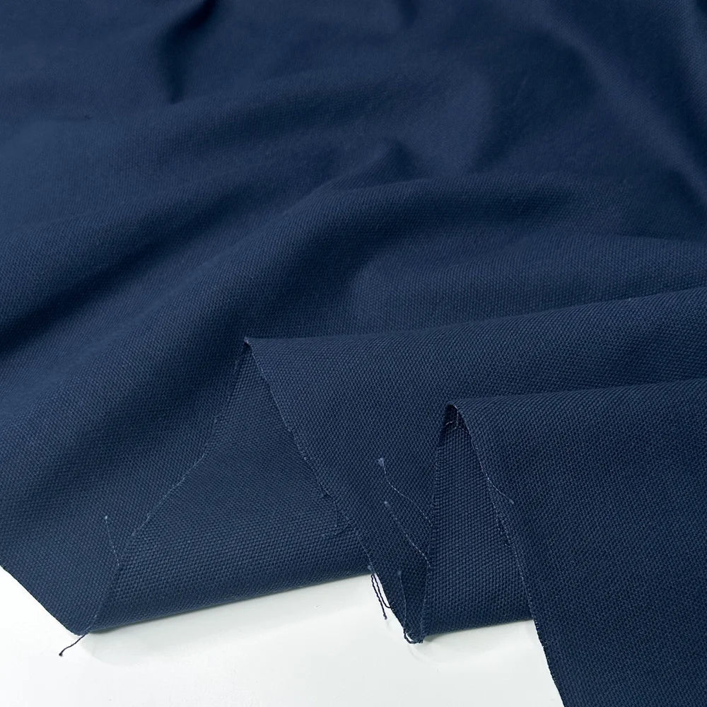 Close-up of dark blue canvas fabric for sewing and crafting, bag making