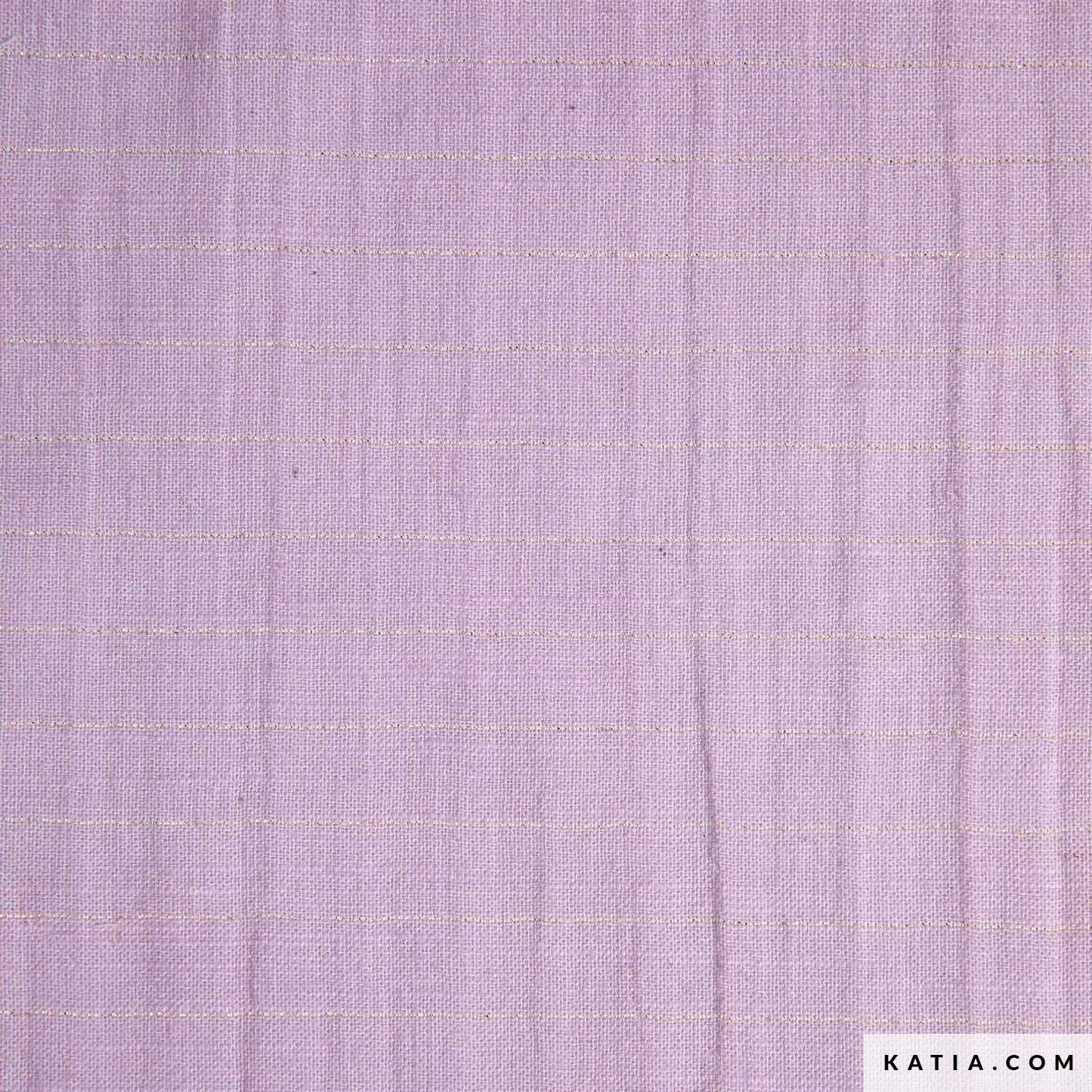 Close up of cotton fabric for sewing garments in lilac with a gold stripe
