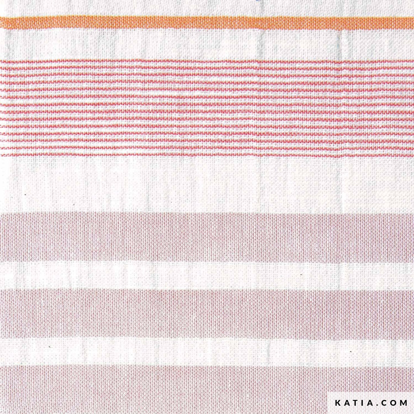 Close up of cotton fabric with pink and orange stripes for sewing and crafting.