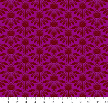 A close-up of a repeating floral pattern on fabric in deep magenta and burgundy, with a white ruler along the bottom edge showing scale. for sewing and quilting