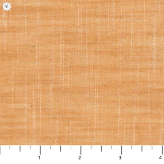 Textured orange fabric swatch with a ruler at the bottom