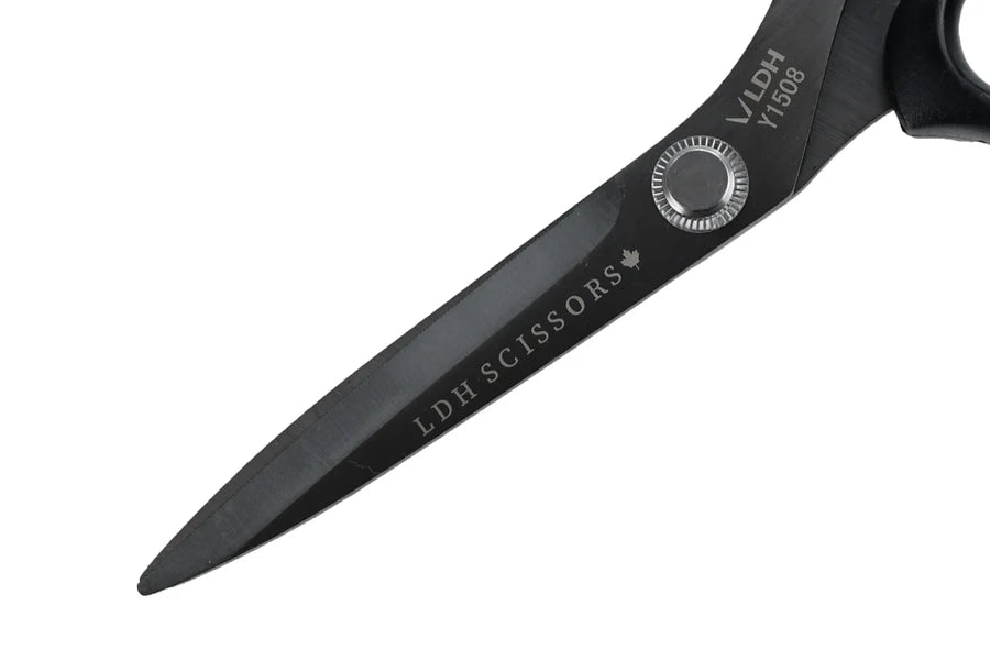 Close up of blades of black scissors with 'LDH Scissors' branding on a white background