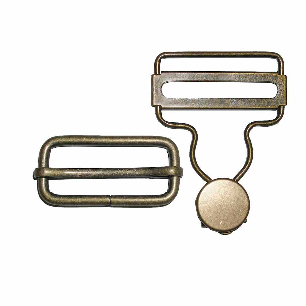 Two 1.5 inch brass buckles and a round brass component on a white background