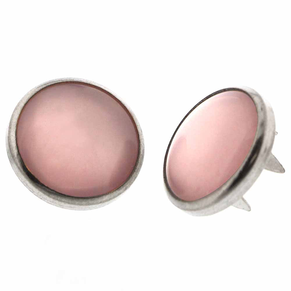 Pair of pearl snaps on a white background