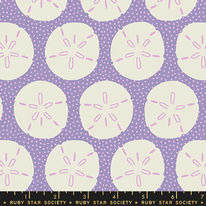 Pattern of light sand dollar circles with pink centers on a purple background with white polka dots, Ruby Star Society label at the bottom.