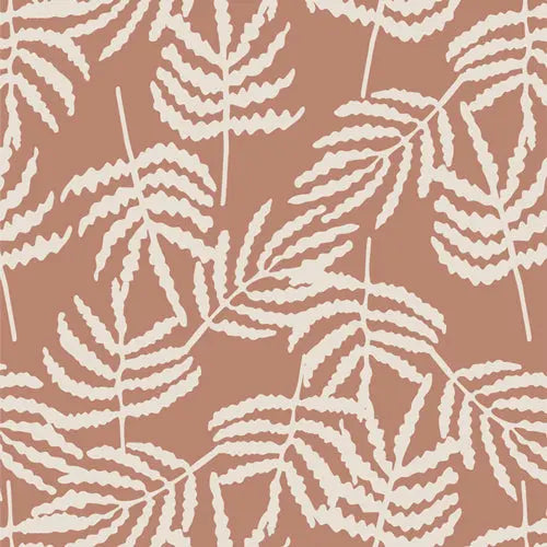 Rayon fabric with cinnamon color light background and large fern leaf print. For sewing flowy garments.