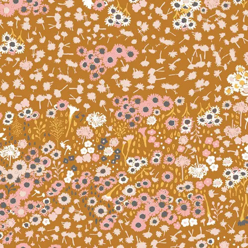 A piece of tan cotton jersey knit fabric with floral field pattern. Cotton spandex for sewing.