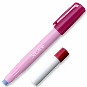 A Sewline water soluble fabric glue pen with a pink body and a white cap, alongside a red refill bottle.