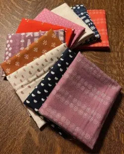 collection of premium quilting cotton in various colours.