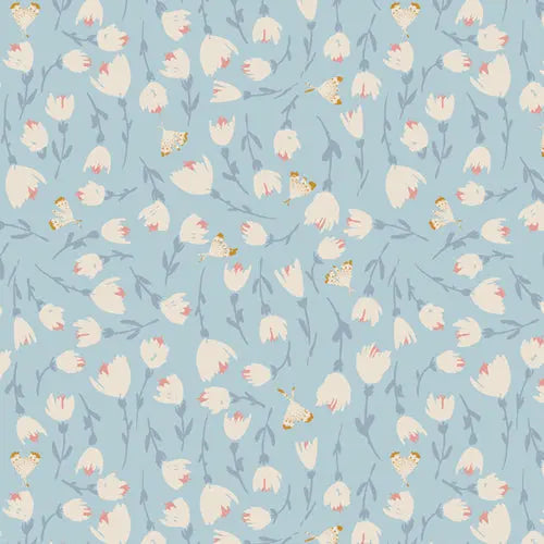 Fabric with a light blue background and small white tulip flower pattern. 