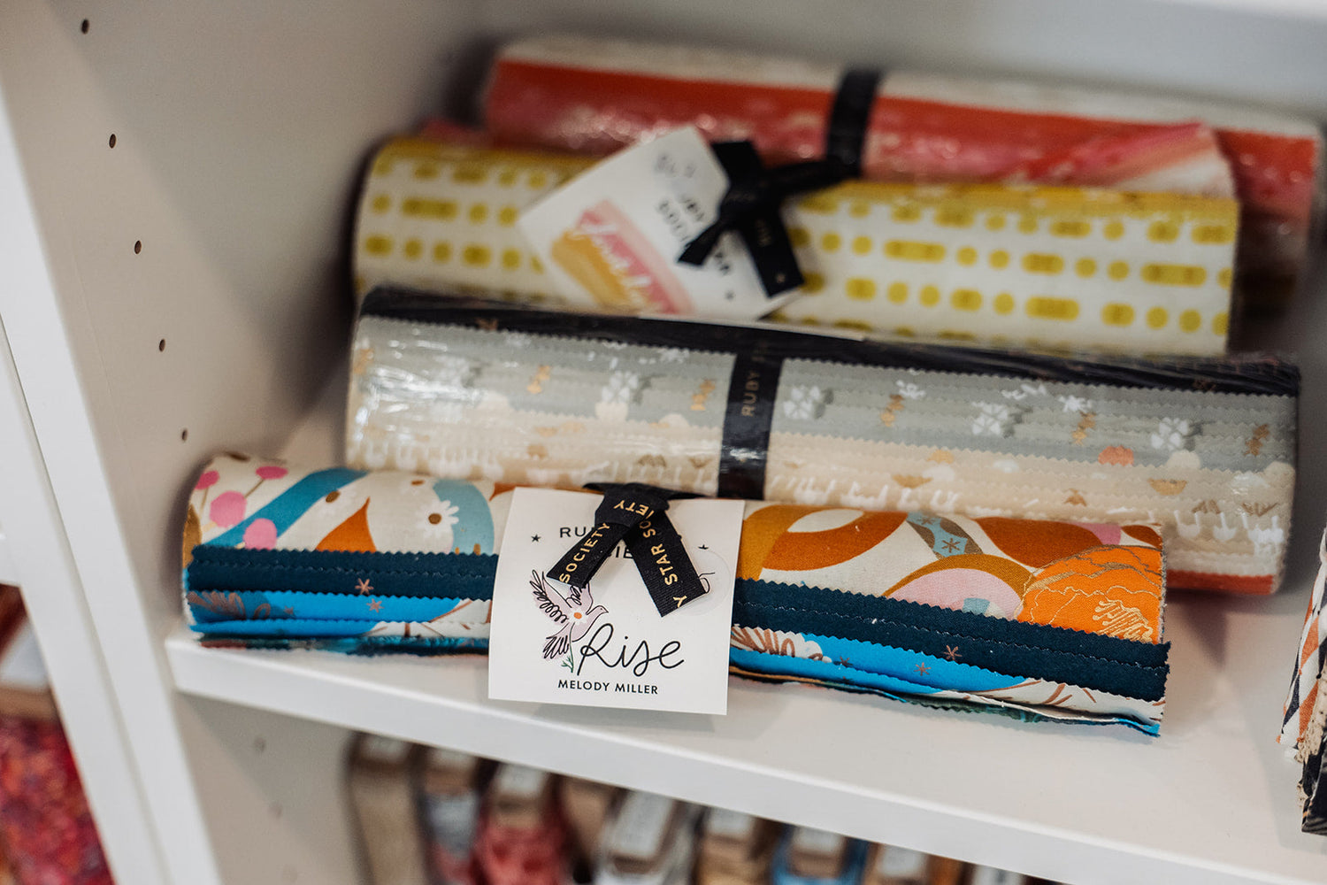 Picture of fabric bundles and other gift items for sewists and crafters