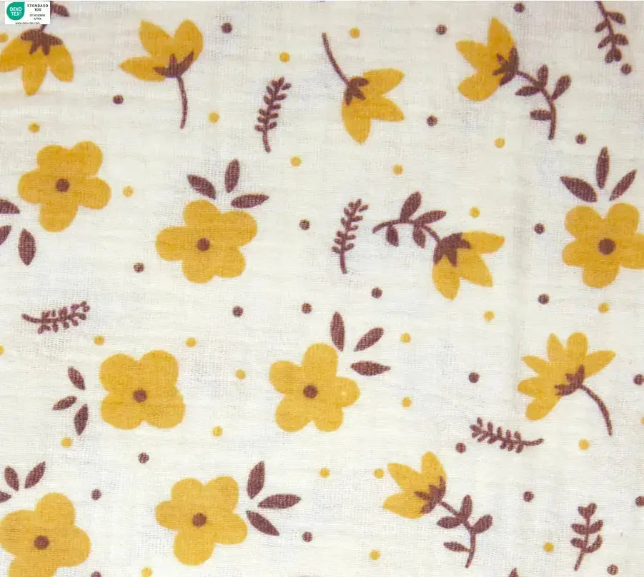 Muslin fabric with a white background and yellow flowers