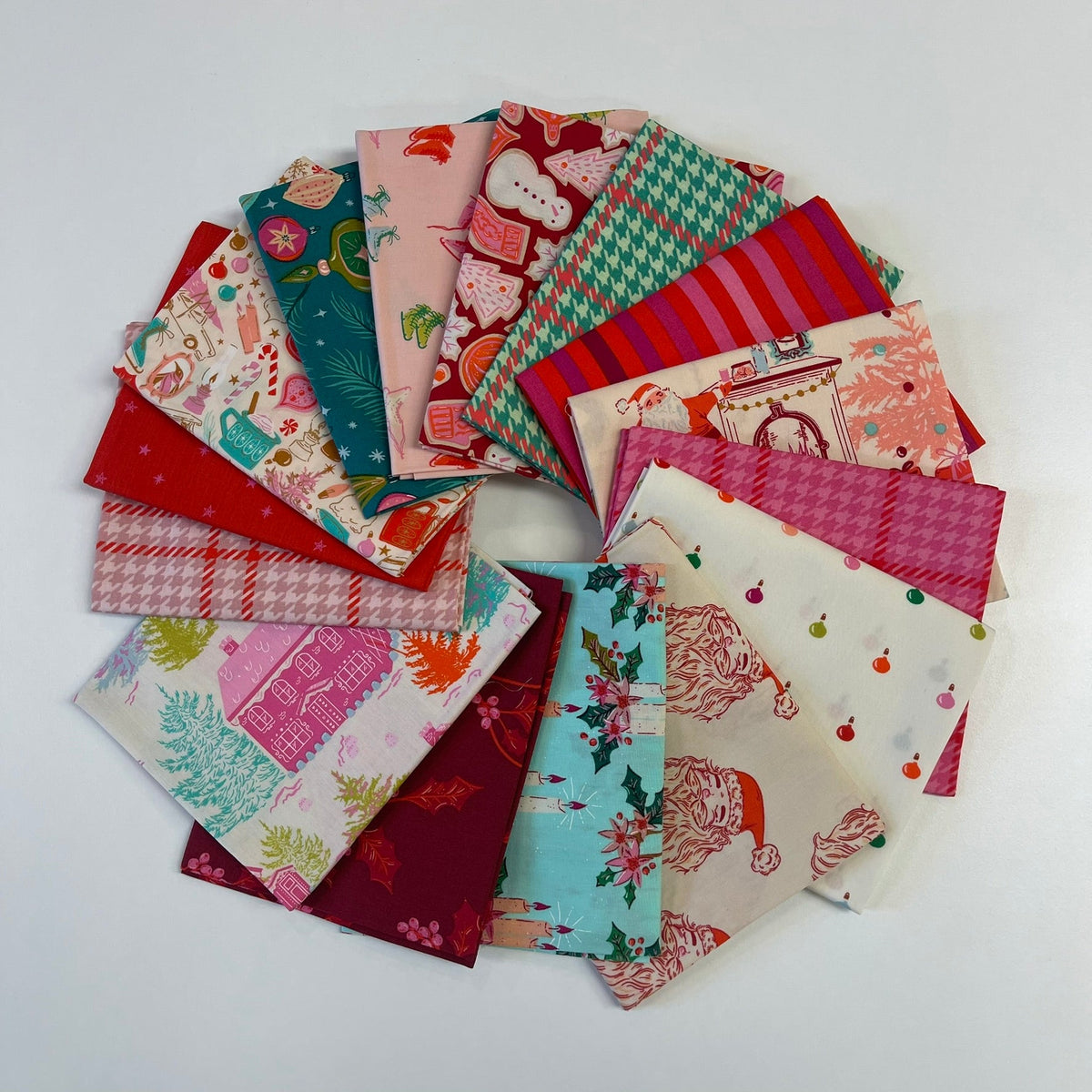 A circular arrangement of assorted fabric swatches with various holiday-themed patterns including Santa Claus, snowflakes, houndstooth, stripes, and floral motifs on a white background.