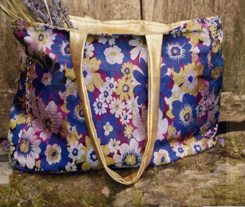 A bag made with purple blue and gold brocade fabric