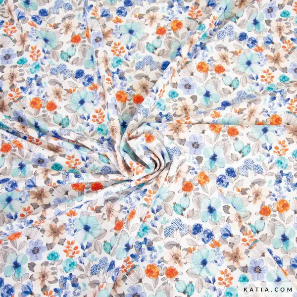Swimwear fabric with a white background and small floral print in blues and oranges.