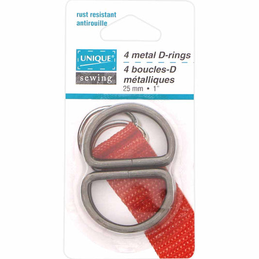 Packaged metal D-rings with red strap on a white background