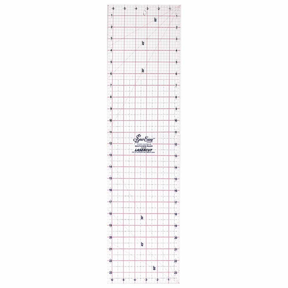 Ruler for cutting fabric rotary cutter with grid lines and measurements on a white background