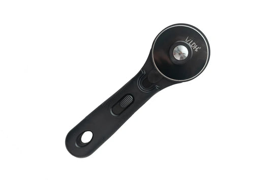 A black rotary cutter with a circular blade housing and a textured handle, featuring a silver metal center pin and the brand name 'LDH' printed on the blade.