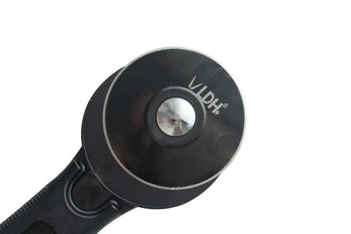 Close-up of a black circular camera lens protector or lens guard with a silver reflective center and the brand name LDH printed in white, set against a plain white background.