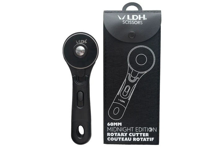 A black LDH Scissors rotary cutter shown next to its black retail packaging box on a plain white background for cutting fabric.