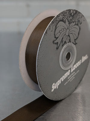 Spool of brown grosegrain ribbon for crafting and decorating 
