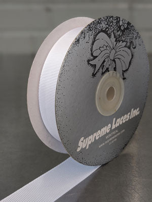Spool of white grosegrain ribbon for crafting and decorating 