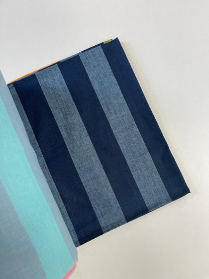 A close-up of a striped fabric or textile sample with alternating dark navy and medium blue vertical bands, shown on a plain light background.