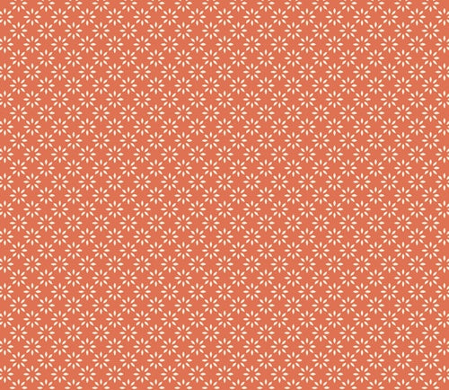 Fabric with a repeating pattern of small white floral or starburst motifs on a warm coral-orange background from Homebody by Art Gallery Fabrics for sewing and quilting. 