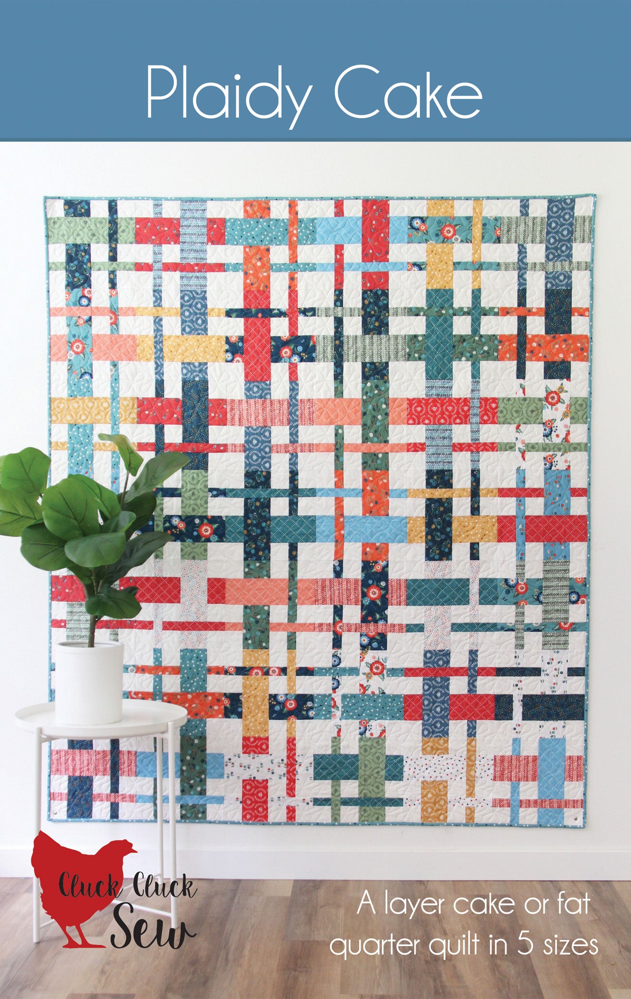 Colorful quilt with plaid pattern on a white wall, for sewing