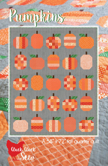 Quilt pattern with pumpkins on a gray background, featuring the brand 'Cluck Cluck Sew'