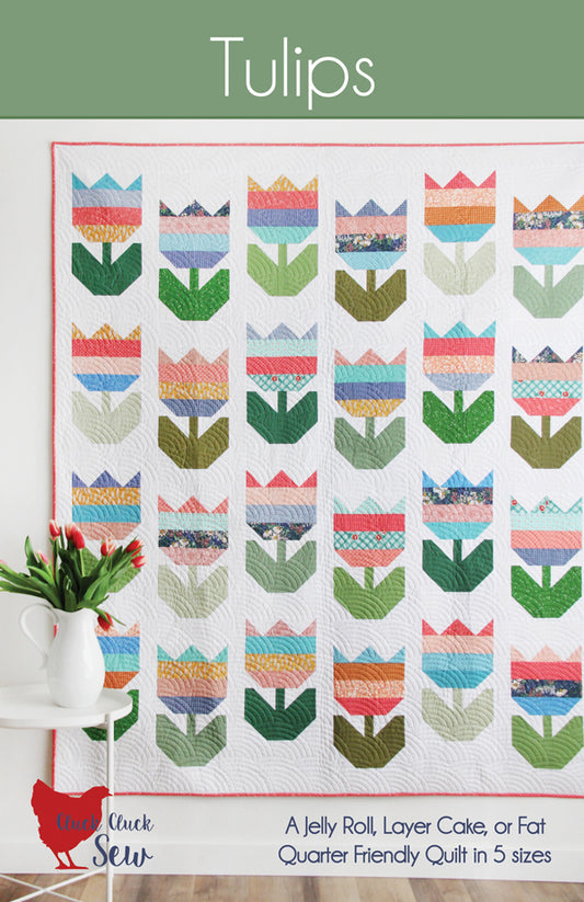 Quilt pattern with tulip designs on a white background