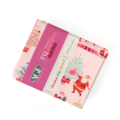 Pack of fat quarter fabric squares with Christmas design and ruler on a white background from Art Gallery Fabrics called Christmas in Color