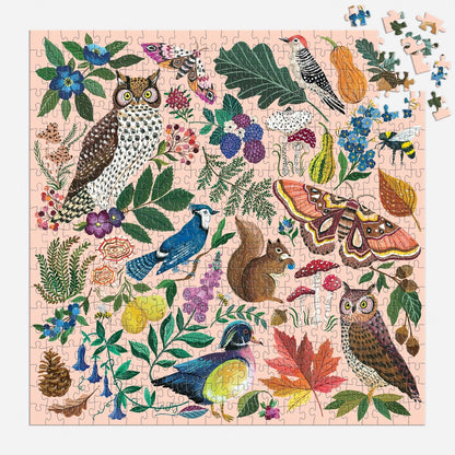 Jigsaw puzzle with nature-themed design featuring animals and plants on a pink background