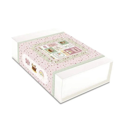 Quilt kit for a baby girl. Decorative box with a pink and green design on a white background