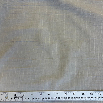 Textured cotton fabric with a ruler at the bottom for scale for sewing 