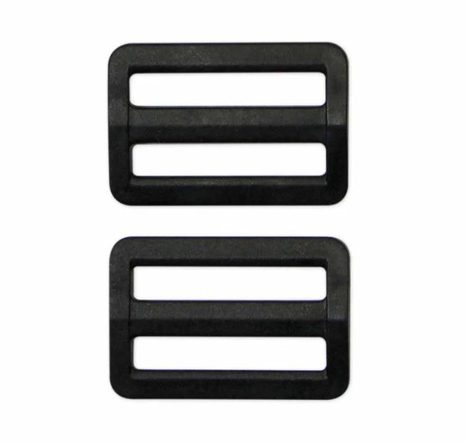 Two black plastic buckles on a white background
