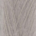 A close-up of light taupe yarn strands, showing the texture and color of the material.