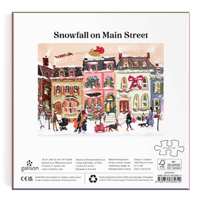 Puzzle box cover with a winter scene of a town and 'Snowfall on Main Street' text, featuring Galison branding.