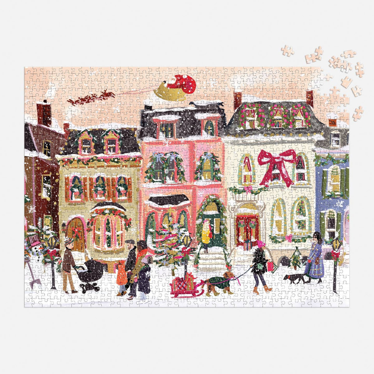 Christmas-themed puzzle with a snowy village scene and people, featuring a pink building with a large red bow.