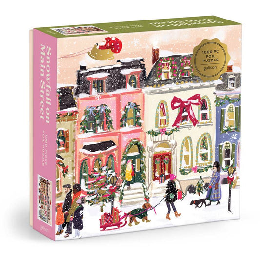 Jigsaw puzzle box with festive village scene on a white background