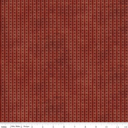 Red fabric with small star pattern, measuring 12 inches wide.