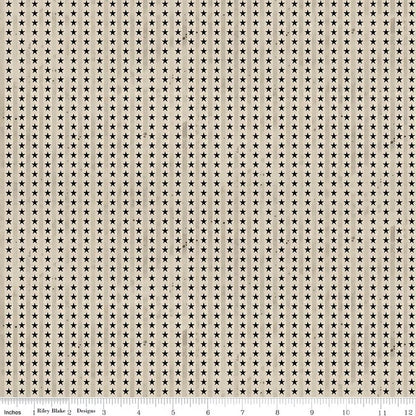 Fabric with small star pattern on a beige background