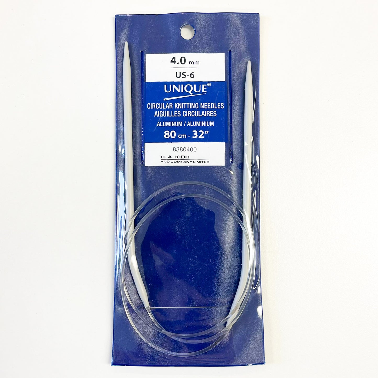 UNIQUE 4.0 mm US-6 circular knitting needles in a blue retail package, shown on a plain white background.