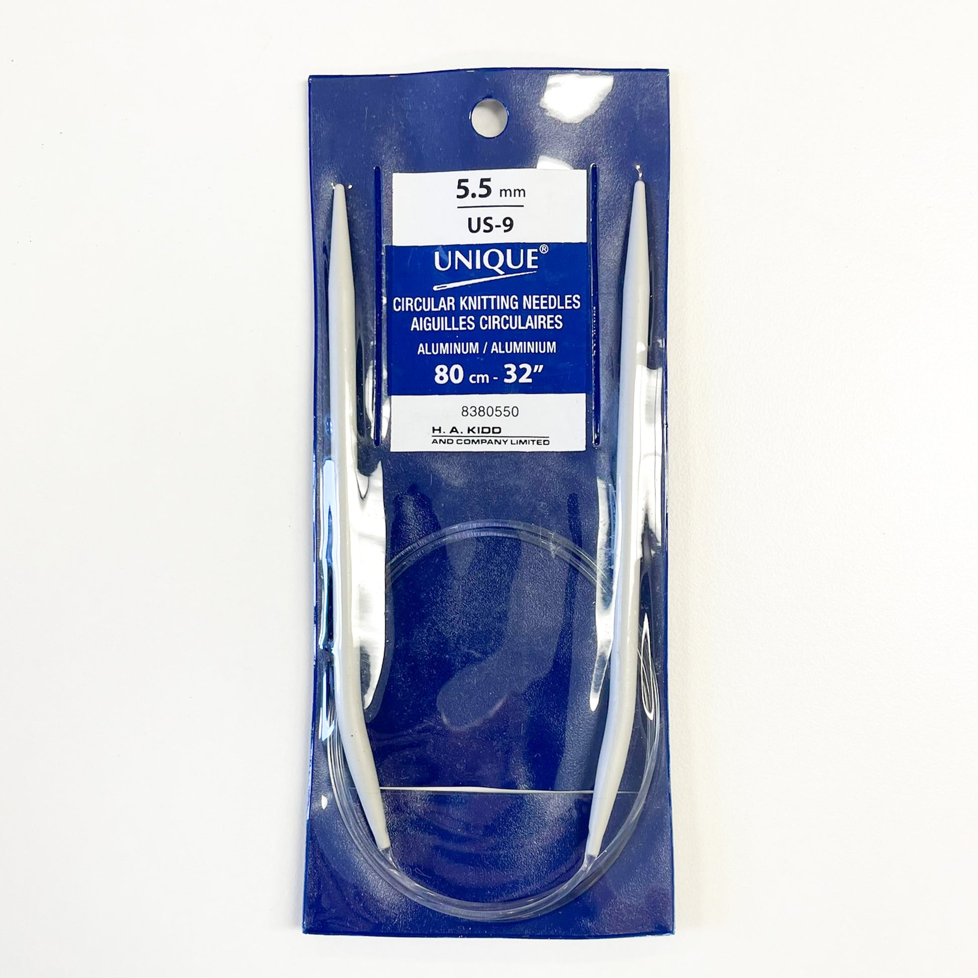 UNIQUE 5.5 mm US.9 circular knitting needles in a blue and white retail package, made of aluminum.