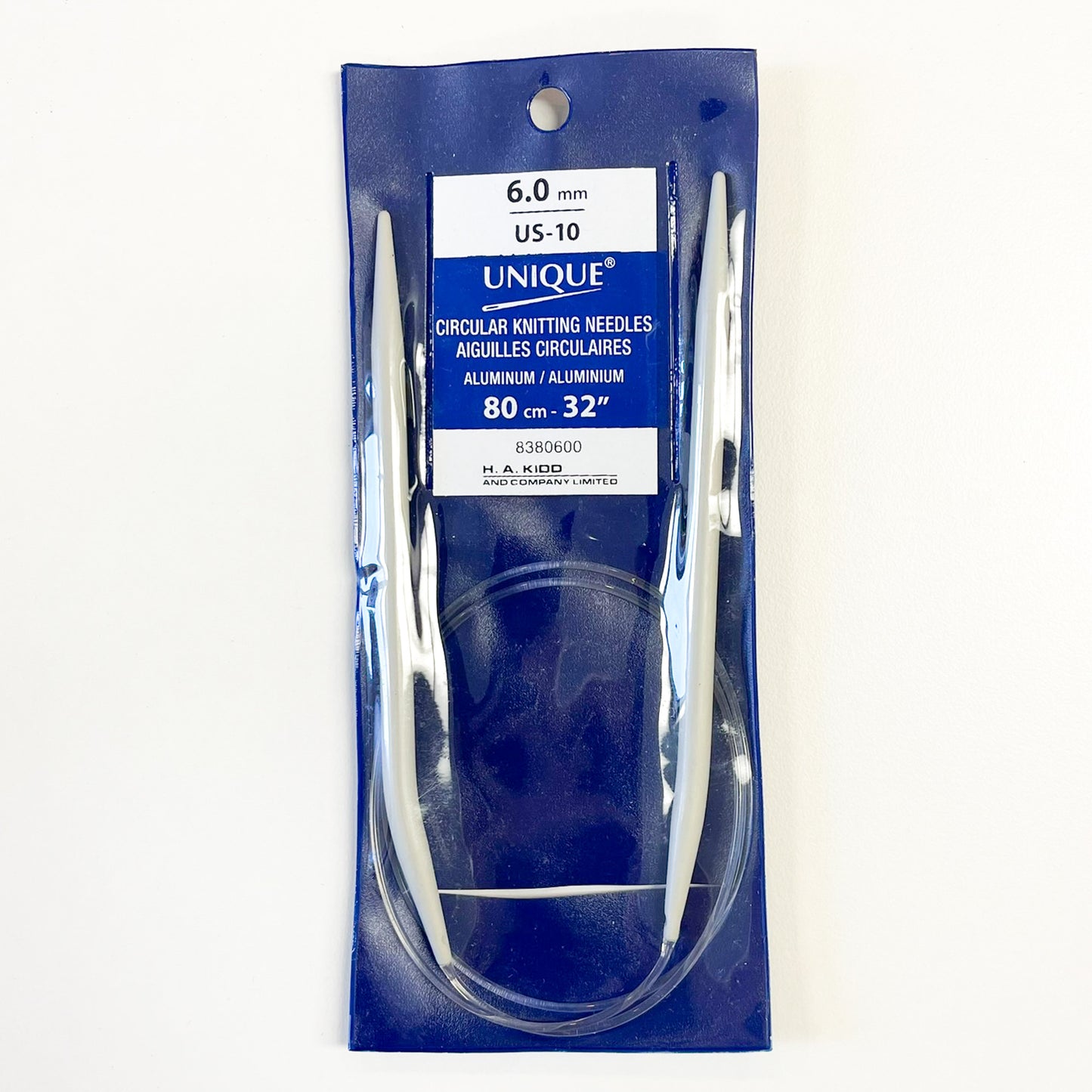 UNIQUE brand 6.0 mm circular knitting needles in a blue plastic retail package, shown against a plain white background.