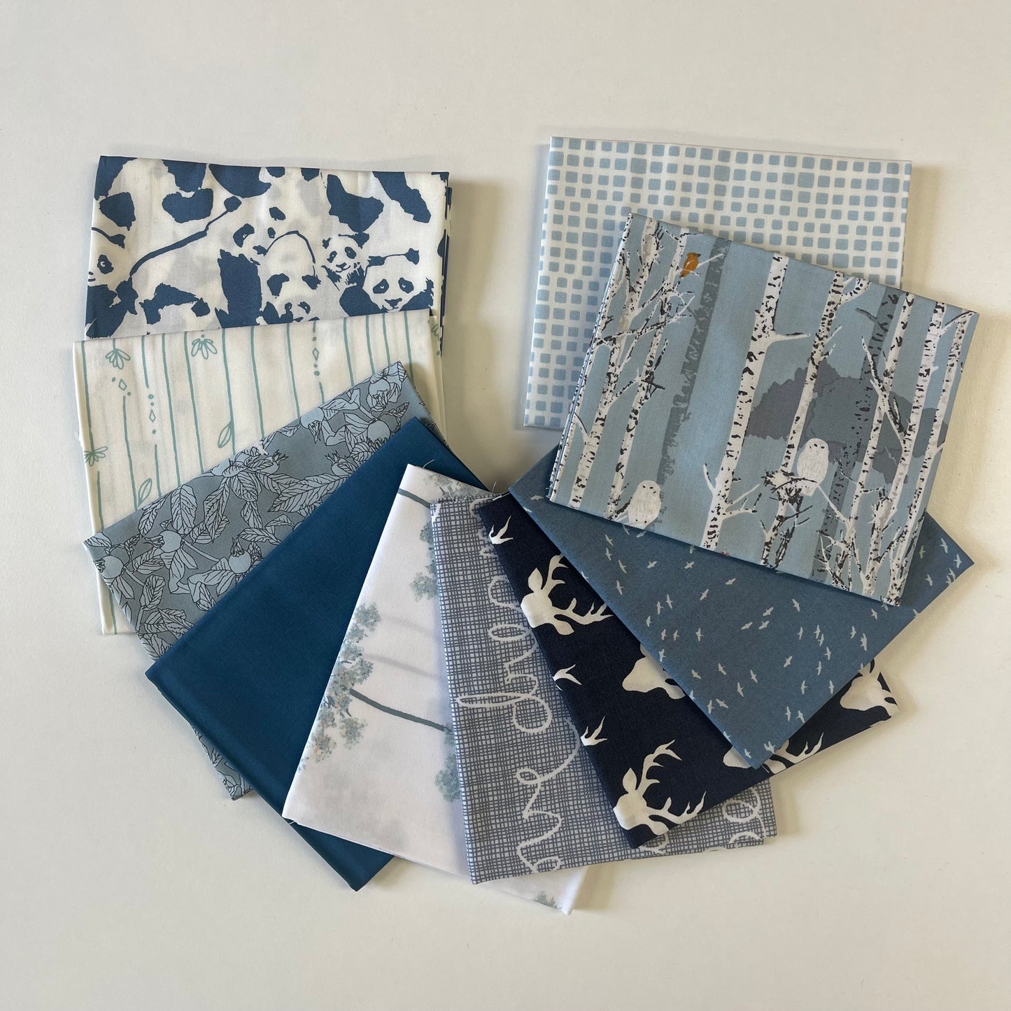 Fat quarter bundle of fabric in blues for sewing and quilting boys.