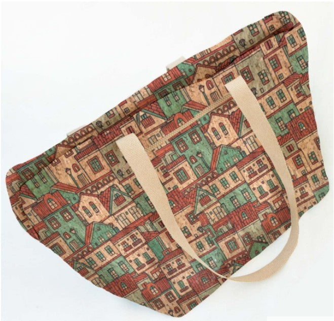 Tote bag made with cork fabric with a pattern of houses on a white background