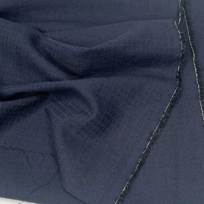 Black cotton linen fabric with subtle check pattern for sewing. 