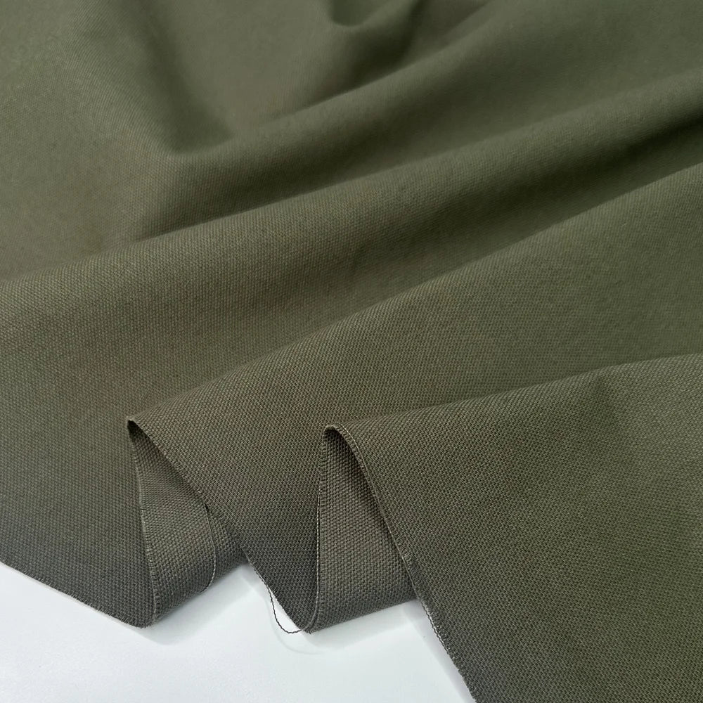 Close-up of olive green canvas fabric for sewing and crafting, bag making